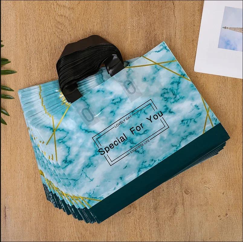 50 шт., новые модели, сумки толщиной 0,14 мм, прочная одежда, косметический подарок, сумки для покупок, эластичные, мощные, портативные, портативные упаковочные сумки