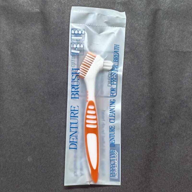 Красочная двусторонняя щетка для чистки зубных протезов - Предмет первой необходимости.