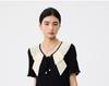 French ruffle collar short sleeved dress for women in the summer of 2026, pleated and pleated, medium to long style, looks slim and black skirt