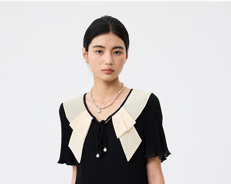 French ruffle collar short sleeved dress for women in the summer of 2026, pleated and pleated, medium to long style, looks slim and black skirt