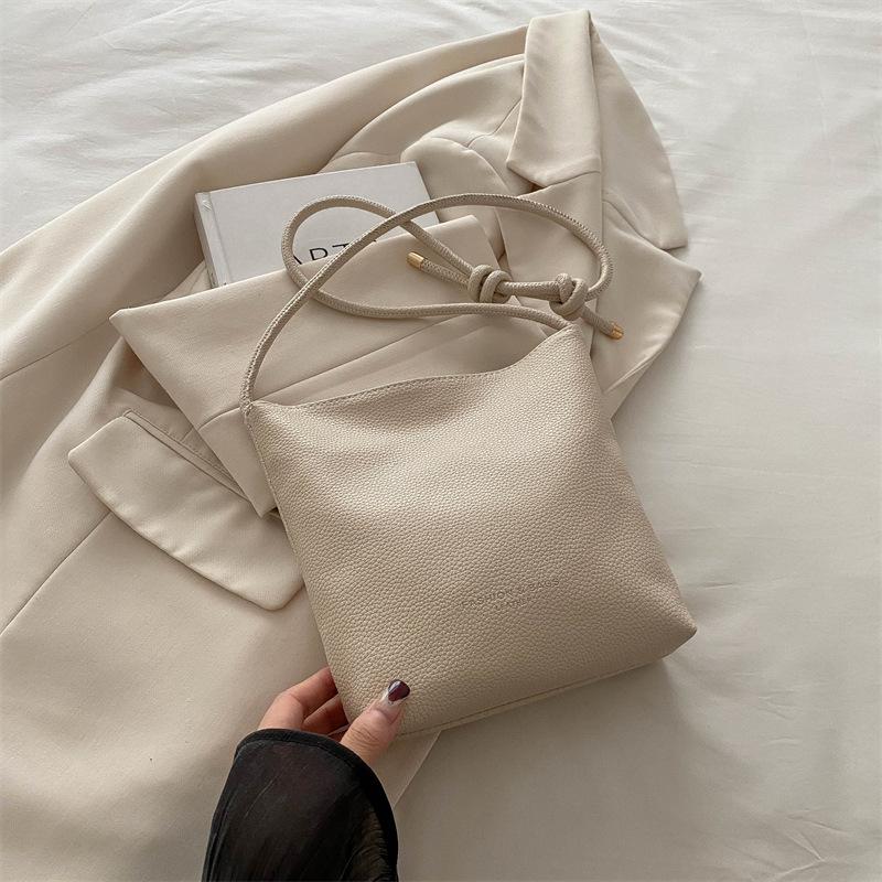 Маленькая женская сумка 2025 новая с узором личи, сумка-ведро под мышкой, нишевый дизайн, универсальная сумка, на плечо, сумка-мессенджер