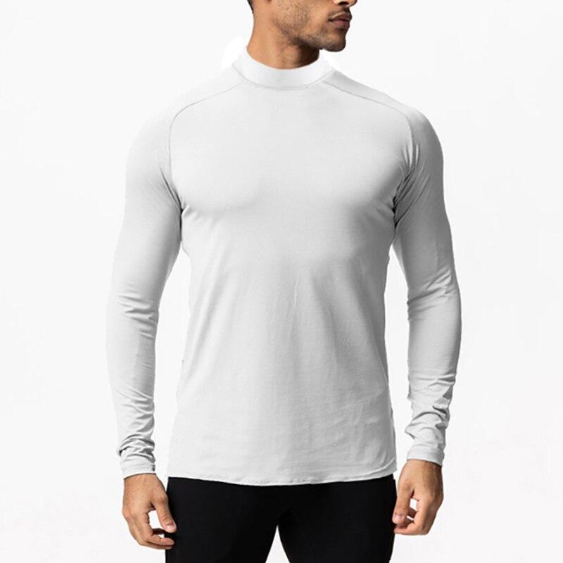 Muscleguys Новые поступления Спортивные футболки с длинными рукавами и высоким воротом Тонкие осенние футболки Slim Fit Мужская одежда для фитнеса