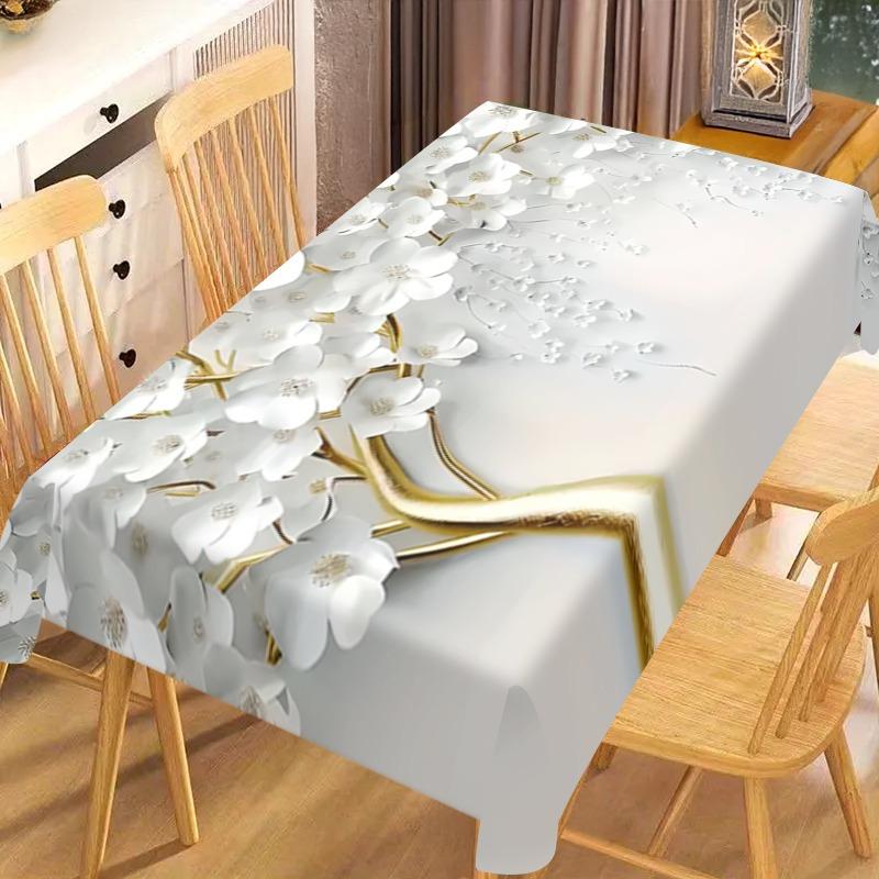 An elegant white floral tablecloth, suitable for use in kitchens, dining rooms, for festive decorations and party settings.zyc