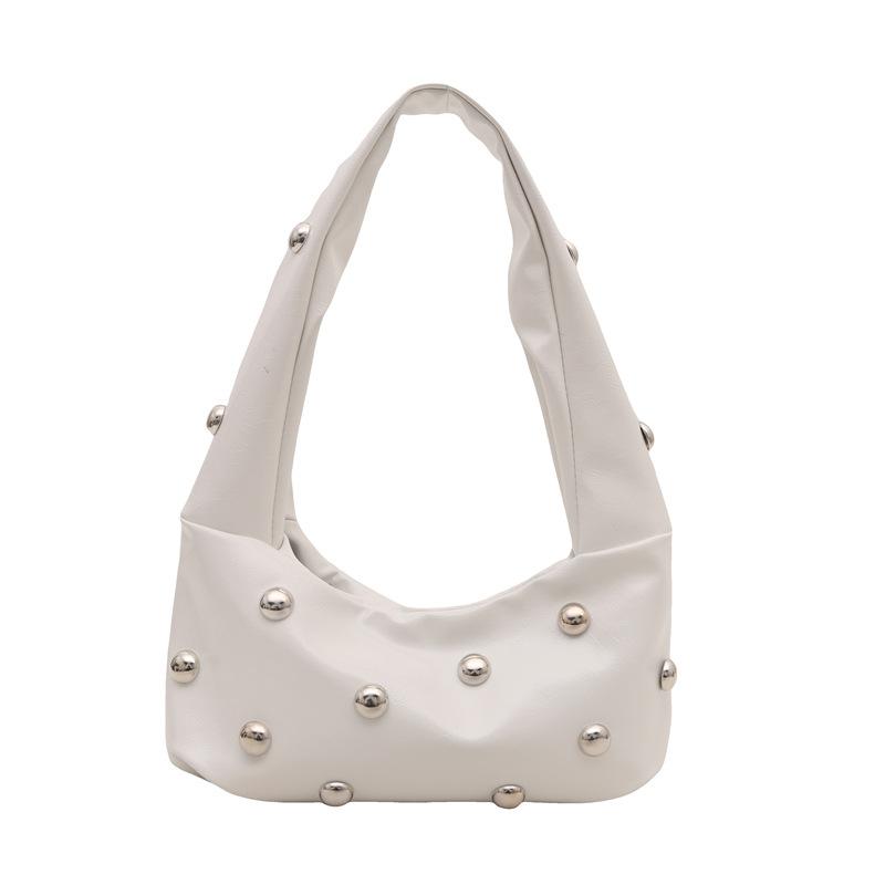 Сумка-подмышка интернет-знаменитости женская 2025 новая корейская версия модной нишевой сумки через плечо, персонализированные заклепки, ручная сумка-пельмень из искусственной кожи