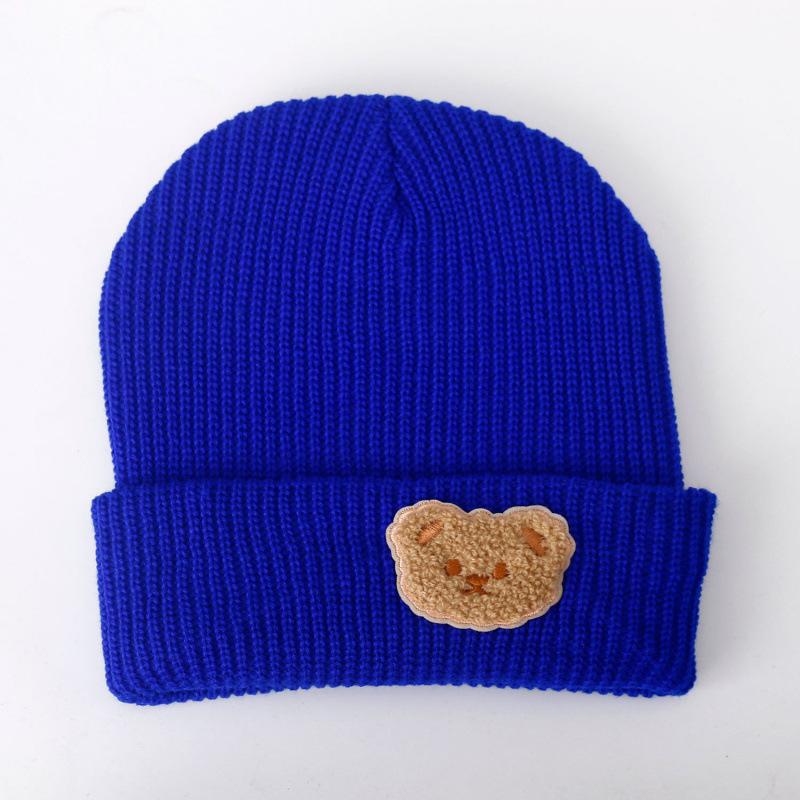 Милая шапка из шерсти однотонного цвета с мишкой, женская новая осенне-зимняя теплая с защитой ушей, универсальная вязаная шапка, тренд