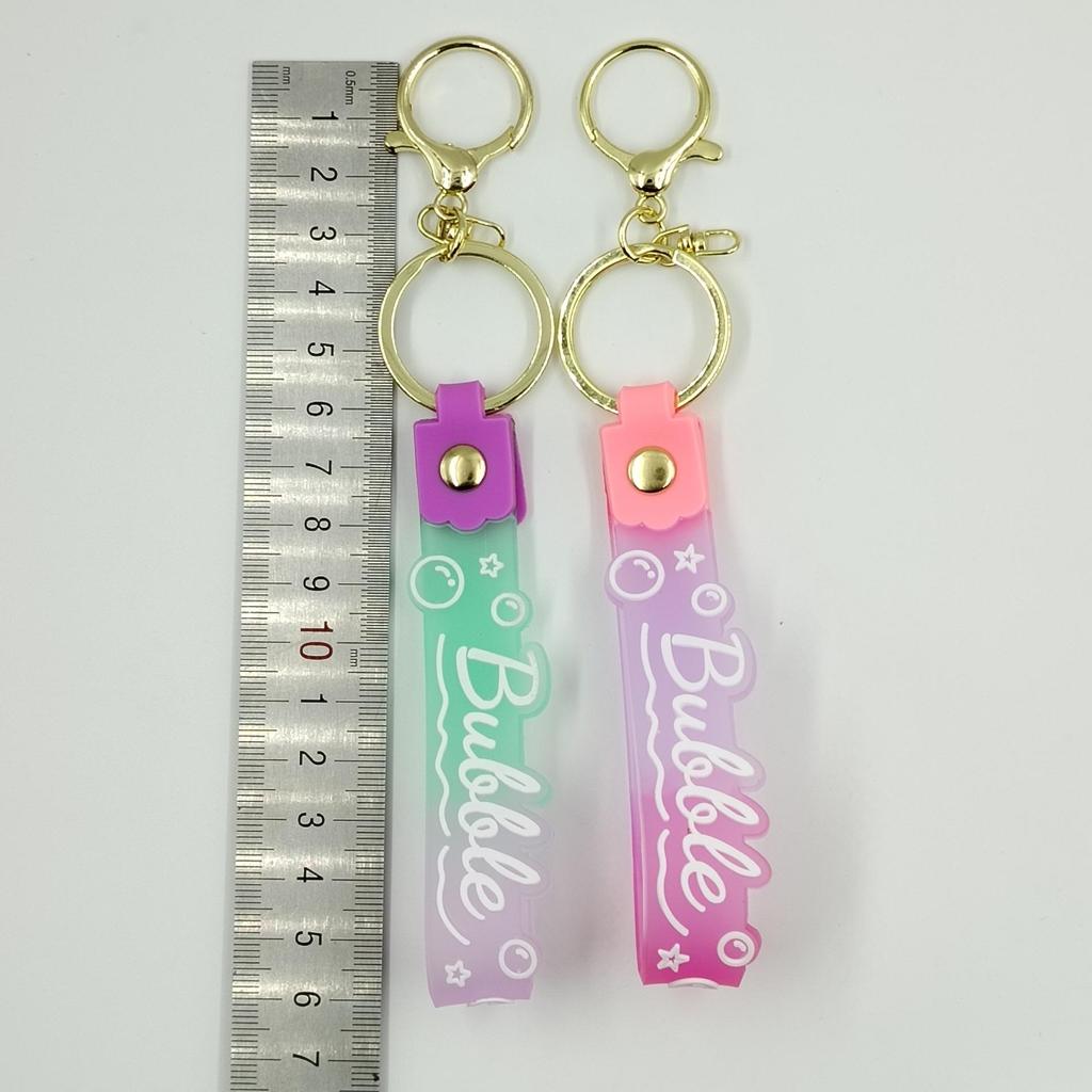 PVC Keychain with Leather Cord and Candy Soft Rubber Doll, Transparent Lanyard, and Jelly Gradient Color Hand Rope