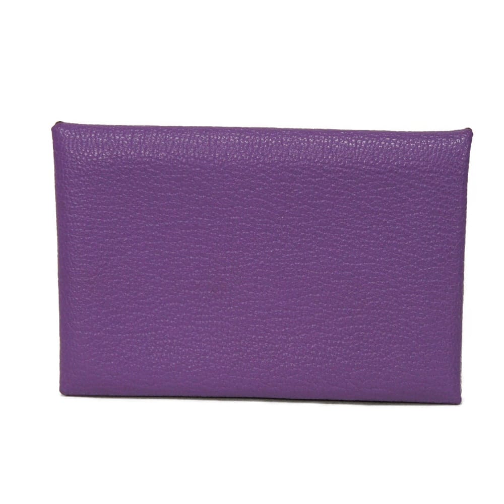Used 9212 Calvi 7946 Chevre Mysore goatskin bag with gold-stamped logo and purple snap buttons. Excellent condition.