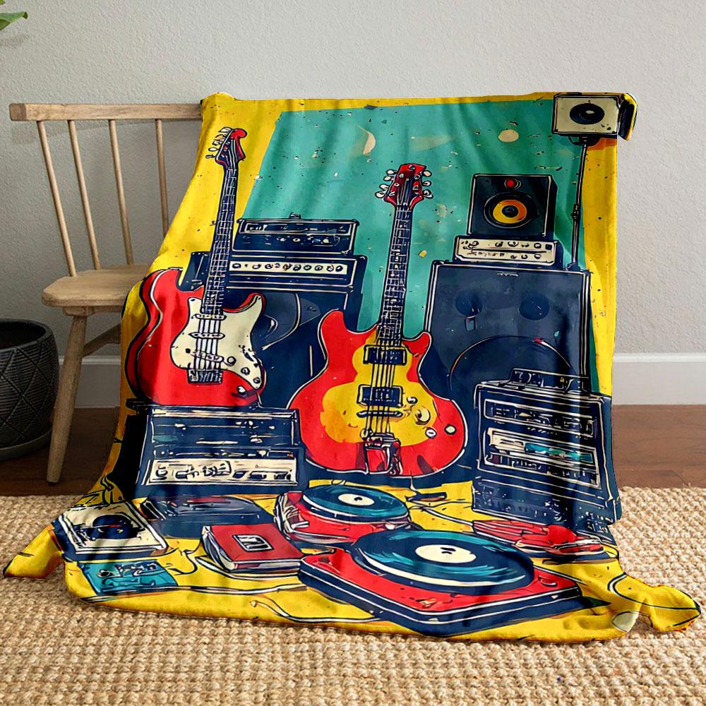 A colorful arrangement of guitars, amplifiers, speakers, and turntables. for all seasons blanket lunch break throw gift