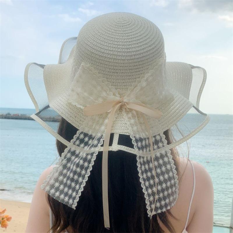 Small fresh and sweet seaside bow mesh sand sunscreen straw hat wavy ribbon fashion streamer large brim sun hat