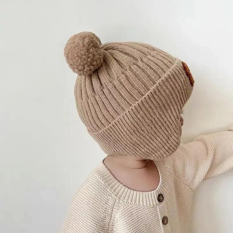 Детские шапки-бини с мультяшным медведем, милые наушники для защиты ушей, вязаная шапка-чепчик для девочек, корейские зимние теплые детские вязаные шапки крючком