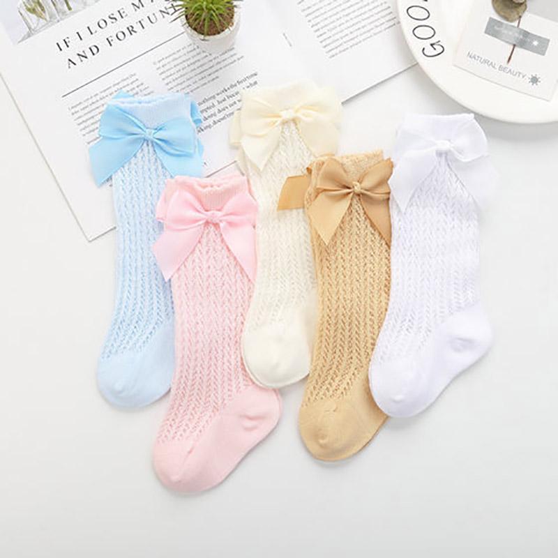 Носочки гольфы для маленькой девочки. Ткань дышащая, цвета нежные, украшены бантиком из ленты