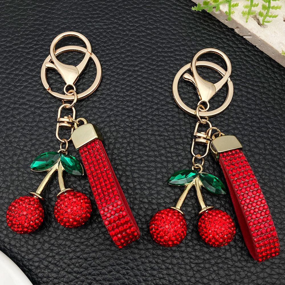 Большой брелок-вишня из смолы со стразами и золотым кольцом