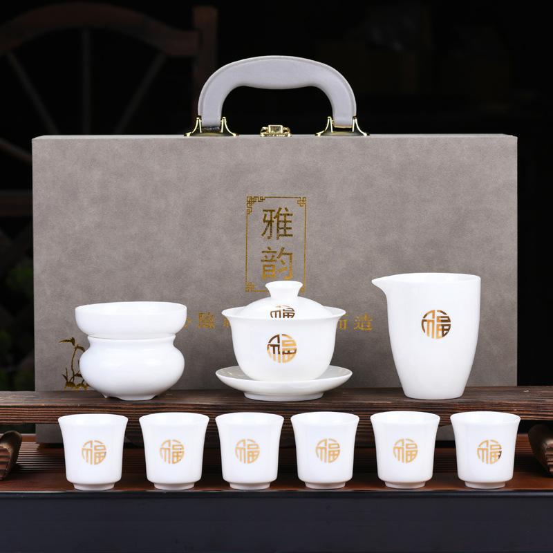Dehua suet jade kung fu tea set, white porcelain cover bowl painted gold tea cup, the whole set of company opening activities