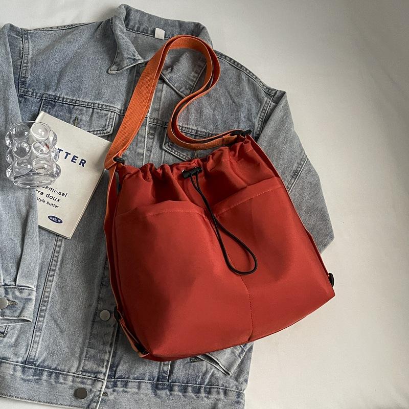 2024 New Japanese Solid Color One Shoulder Underarm Bag Folded Simple Drawstring Lightweight Casual Commuter Double Shoulder Bucket Bag