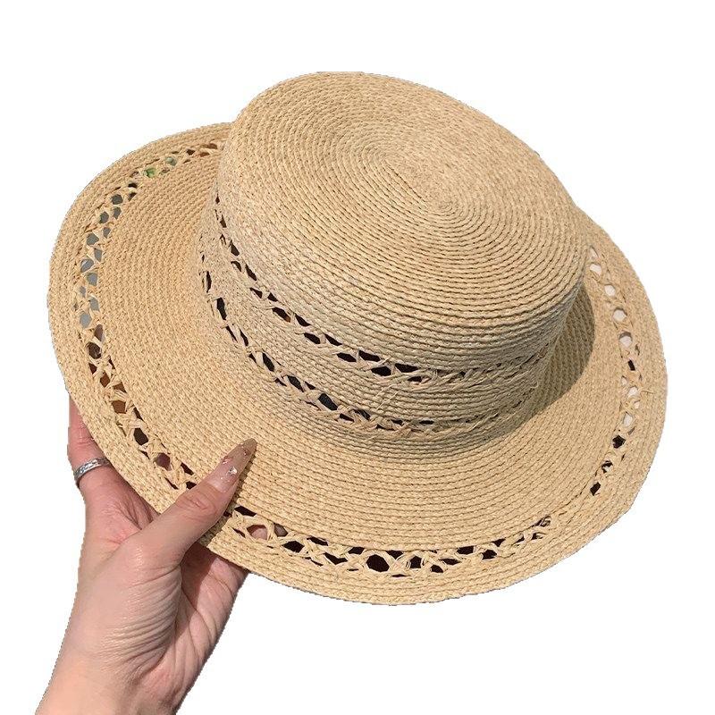 New hollow flat top Lafite straw hat women's summer new seaside beach sun hat French elegant straw top hat