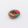 Common Mode Choke Inductor, T12x6x4, 0.35 Wire, Red Bobbin, Split Winding 20mH 2A, with Magnetic Core and Central Partition.