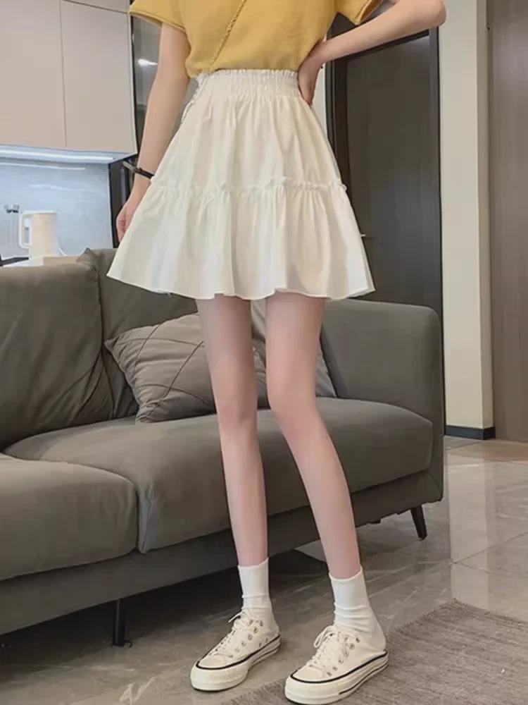 Весна 2024 Белая юбка-фонарик с высокой талией А-силуэта — стиль колледжа и прикрывающий бедра дизайн Fairy