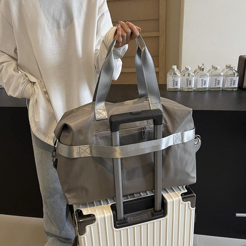 Простая повседневная дорожная сумка большой вместимости для мужчин и женщин студентов во время школьных каникул. Сумка для багажа для рычага