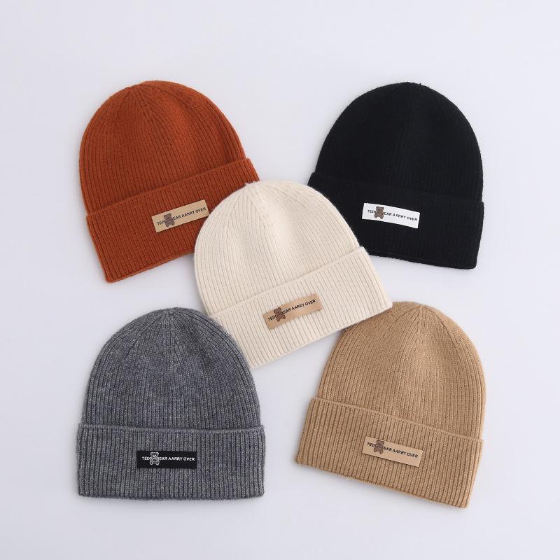 Осенние и зимние шапки женские плюшевые новые вязаные шапки универсальные теплые защитные наушники шерстяные утолщенные модные студенческие шапки