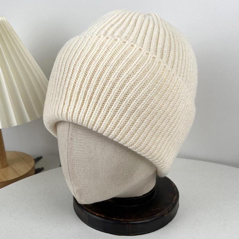 Winter warm wool hat women's outdoor ear protection labeling knitted cold hat student cycling morning running windproof pullover hat