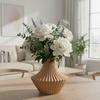 Brown decorative vase in the shape of pleats for flowers, elegant design