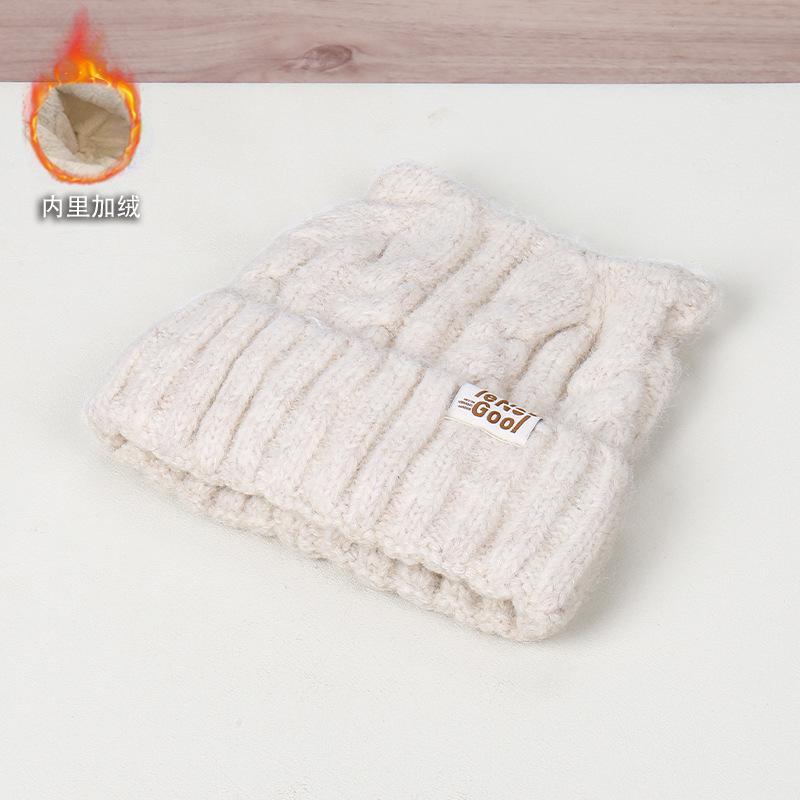 Autumn and winter solid color simple labeling ear decoration knitted hat outdoor travel windproof warm street shot wool hat