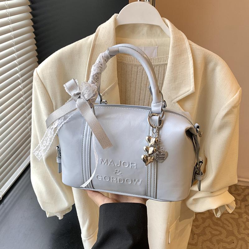 Модная нишевая сумка-боулинг для ручной носки женская 2025 новая трендовая корейская версия, высококачественная сумка на плечо, универсальная сумка-мессенджер