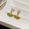 Fan-shaped ear clips, high-end stud earrings, female niche design, emerald zircon, foreign gas earrings, mosquito coil disc, without ear piercings.