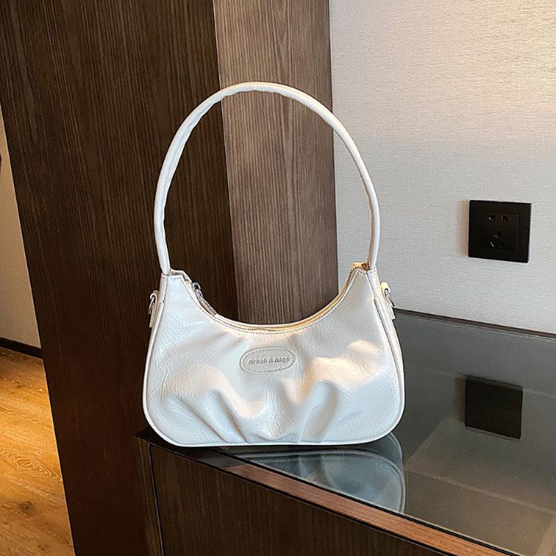 Корейская версия подмышечная сумка складная искусственная кожа однотонная женская сумка нишевый дизайн чувственная текстура одно плечо сумка простая новая