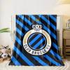 Diagonal black and blue stripes with a central crowned circular emblem. for all seasons blanket lunch break throw gift