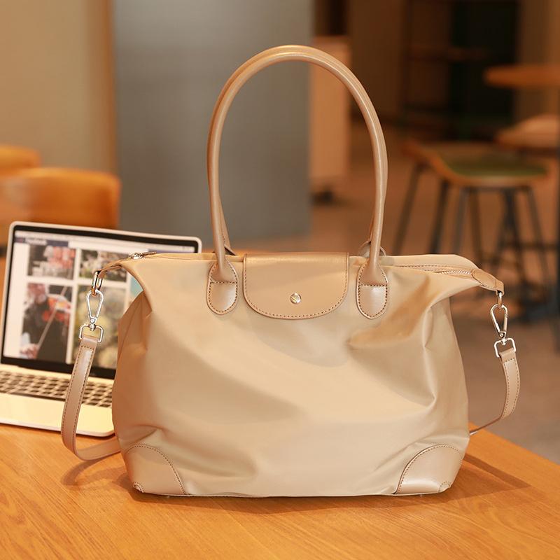 Simple and casual handbag tote bag, dumpling bag, women's briefcase, niche high-end large-capacity crossbody commuter bag