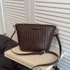 Large-capacity woven hand-carried bucket bag women's summer new high-end casual shoulder messenger bag