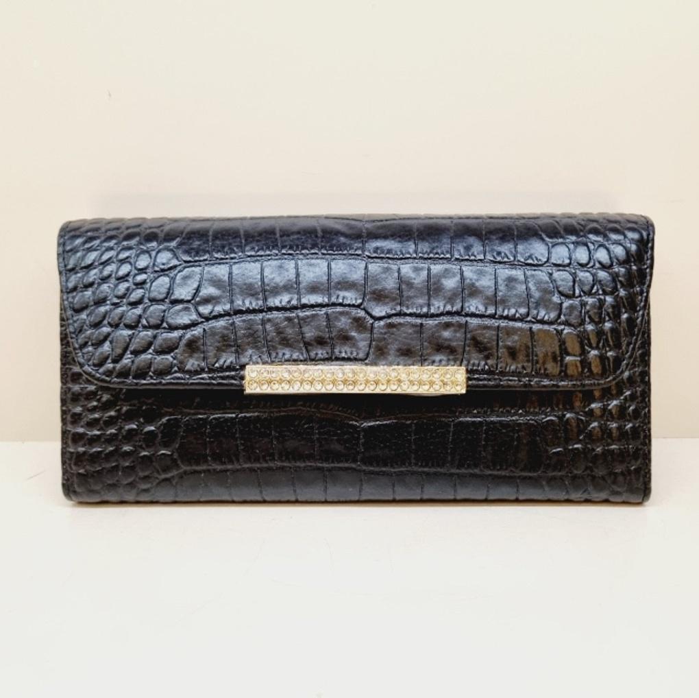 A soft, slim women's long wallet with a subtle pattern.