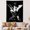 A stylish woman in a black dress with dual swords on her back. Patterned tapestry for bedroom and living room home decor