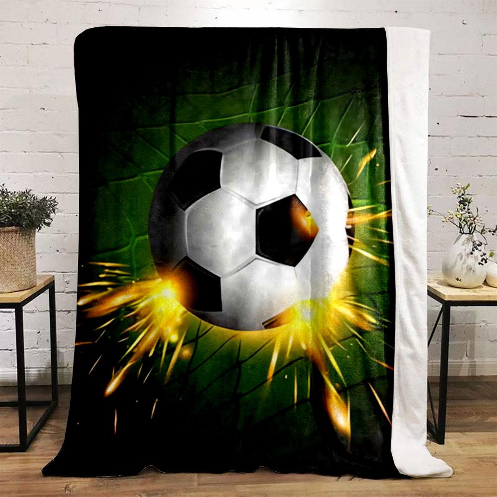 A soccer ball hitting a green net with bright orange sparks. for all seasons blanket lunch break throw gift
