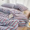 Simple Red and Blue Striped Duvet Cover and Four Piece Bed Sheet Set with Washed Cotton Bedding On the Bed