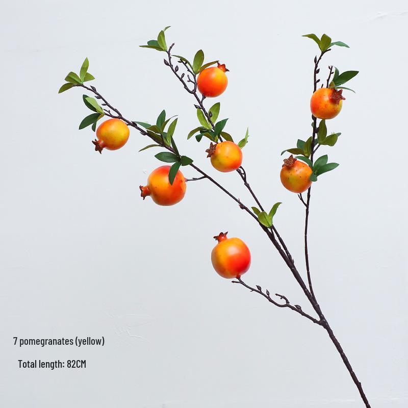 New Year Floral Arrangement with Golden Eucalyptus, Fan Leaf, Simulated Holly, Ginkgo, and Golden Leaf.