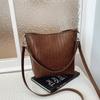 Niche woven pattern bag women's new simple bucket bag casual commuter shoulder messenger bag