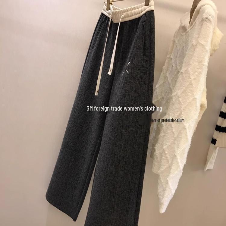 Женские фактурные брюки широкого покроя: Стильная вышивка и узор «елочка» для осени/зимы