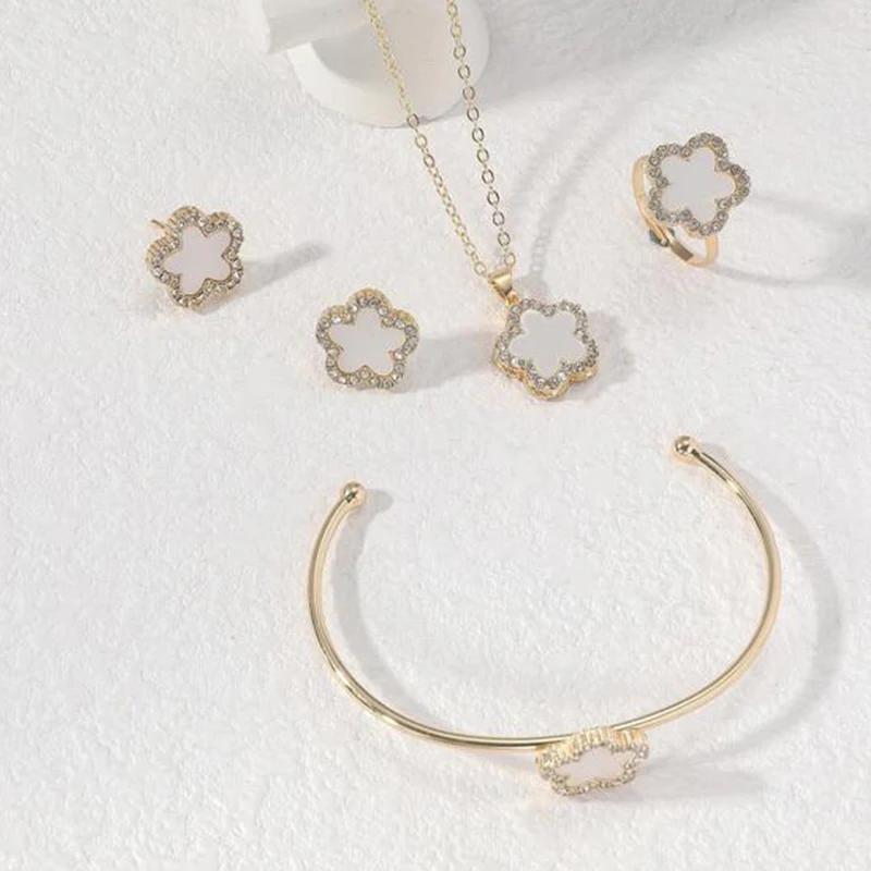 Elegant Gold Tone Clover Jewelry Set - Rhinestone Inlaid Black/White Four - Leaf Clover Necklace Earrings Bracelet Ring Set