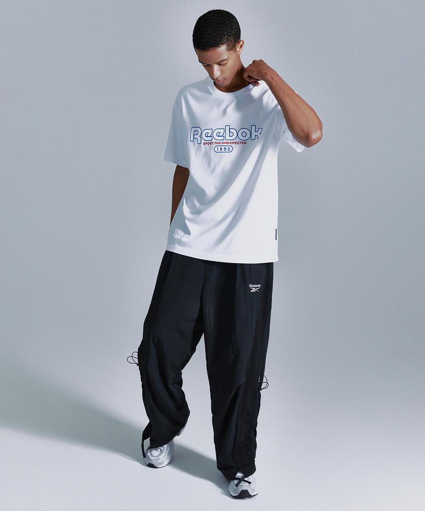 Reebok Широкие брюки Rival Ripstop - Черный