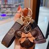 Изысканный классический кожаный брелок-подвеска для автомобиля в виде старого цветка с милым шариком и мультяшным мехом кролика рекс для женских сумок