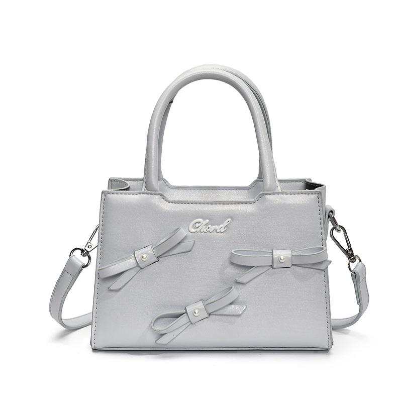 Корейская версия сумки-банта маленькой квадратной формы женская 2025 лето новая простая и модная ручная женская сумка женская на плечо через плечо