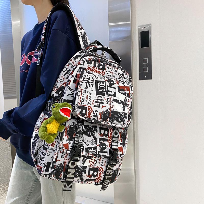 Junior high school college student schoolbag female graffiti backpack large capacity trendy cool boys fashion high value travel backpack