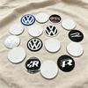 2026 New 4Pc 56mm 60mm 65mm Car Logo Wheel Center Hub Caps Badge Sticker Emblem Decals For VW GTI Golf 6 Polo R-Line CC Passat Tiguan B7 NL9