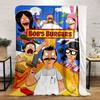 Cartoon characters surrounding a "Bob's Burgers" sign with food and items. for all seasons blanket lunch break throw gift