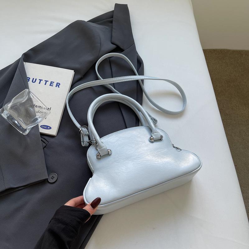 Премиальная нишевая сумка с чувством, женская весна-лето 2025, новая модная простая сумка-мессенджер, женская портативная сумка-боулинг