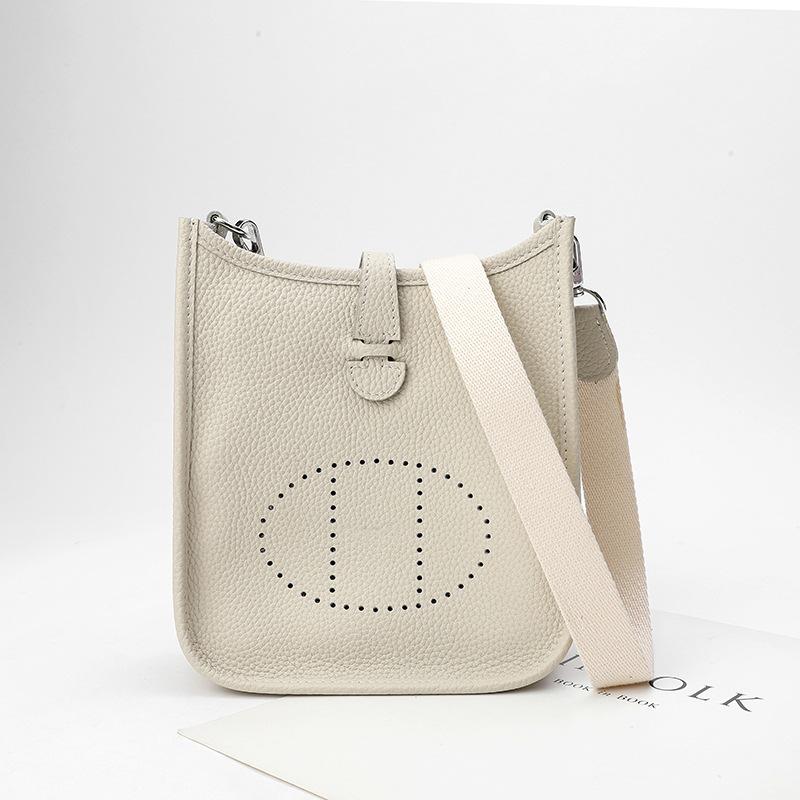 Фабричная оптовая продажа сумка-ведро из натуральной коровьей кожи первого слоя женская сумка с узором личи полый дизайн на одно плечо через плечо полый дизайн