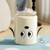 A trash can with wheels. Features a cute cartoon dog design. Practical and serves as a home decor item.
