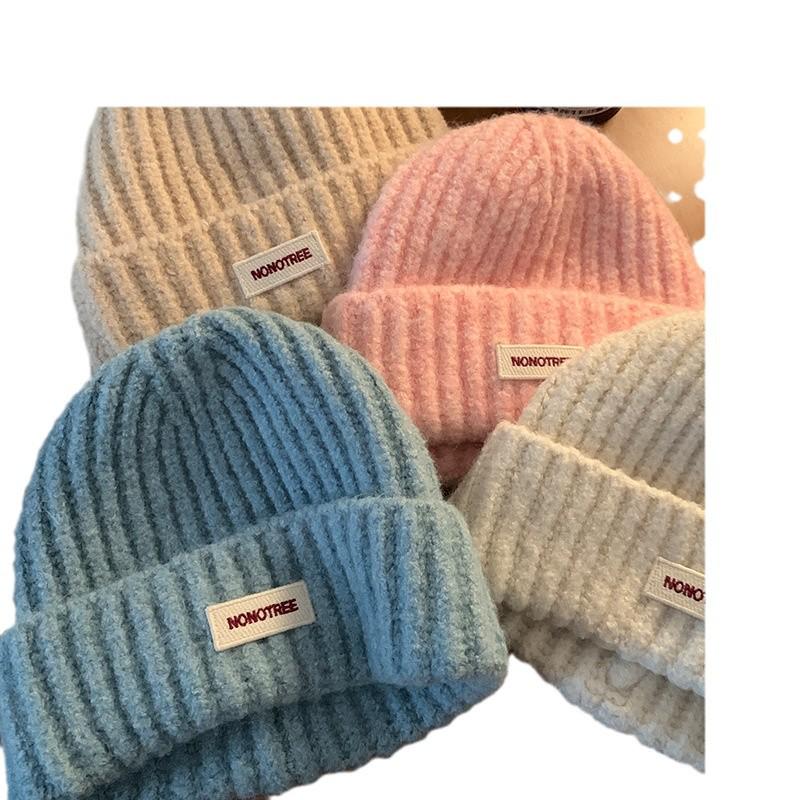 Женская вязаная шерстяная шапка синего цвета на осень/зиму 2024 года — свободный крой, утягивающий дизайн, теплая защита ушей